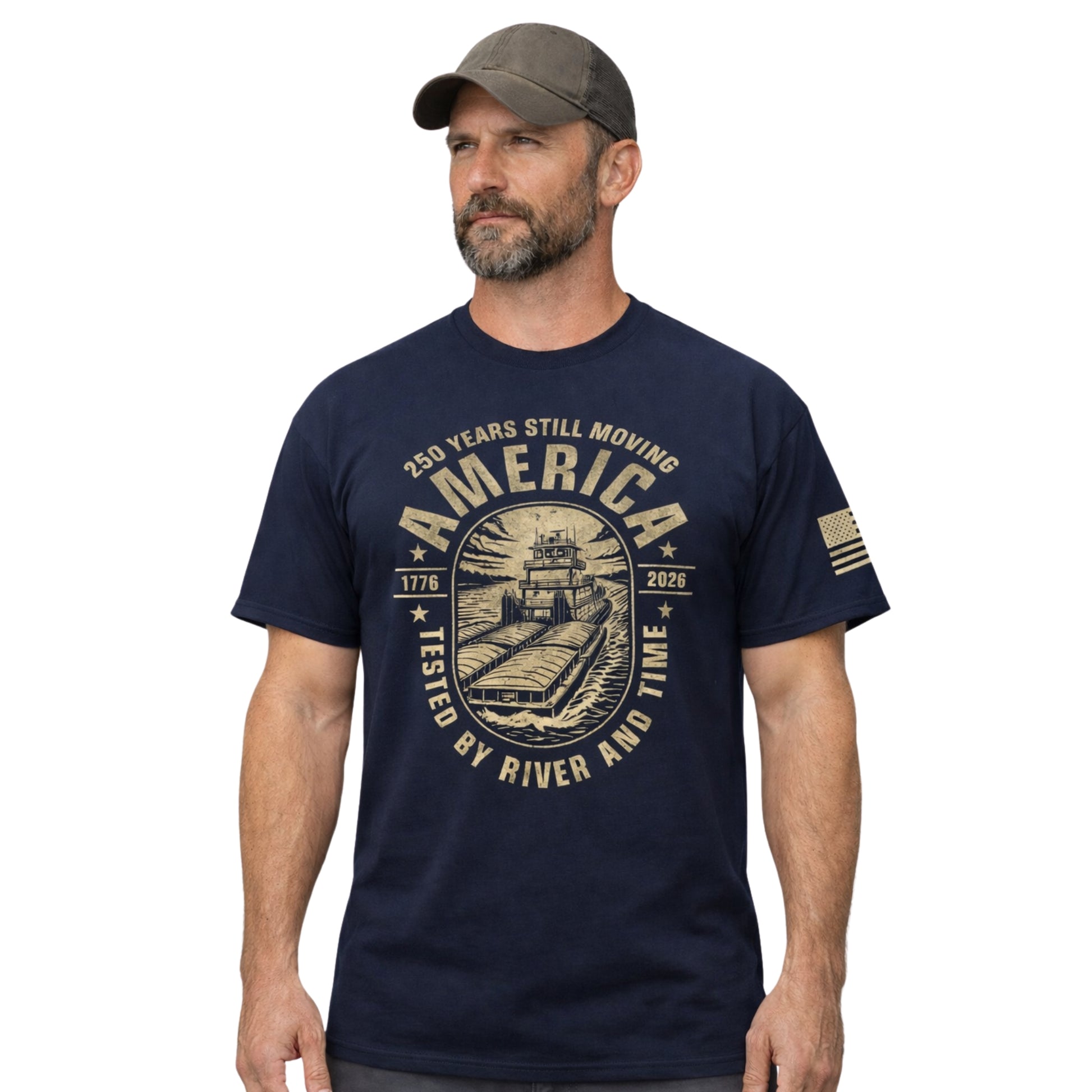 Man wearing a navy blue t-shirt with a graphic design and cap on a white background