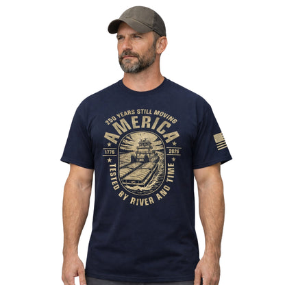 Man wearing a navy blue t-shirt with a graphic design and cap on a white background